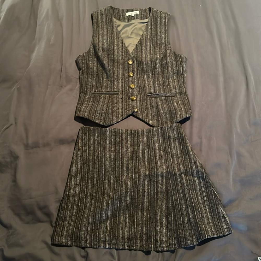 Striped brown and grey vest and side pleated skirt